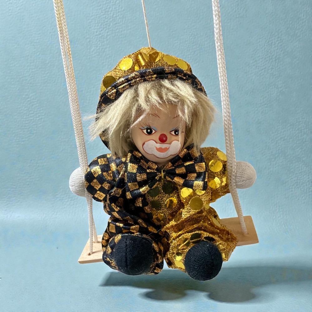Porcelain Sand Doll Clown on Wooden Trapeze‎ Swing Gold Black Sequins